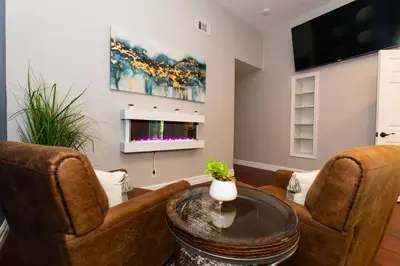 a living room with two chairs and a table at Feel At Home In MV - 'Good Vibes Only' Mentality in Mission Viejo