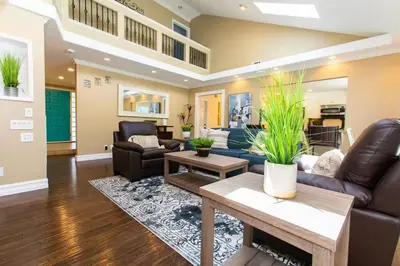 a living room with a couch and a table at Feel At Home In MV - 'Good Vibes Only' Mentality in Mission Viejo