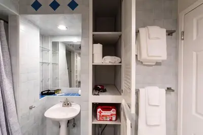 a white bathroom with a sink and a toilet at Feel At Home In MV - 'Good Vibes Only' Mentality in Mission Viejo