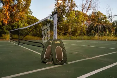 a pair of shoes sitting on a tennis court at Mountain Villa in San Diego - Pool & Waterslide, Spa, Pickle Ball, Game room in La Mesa