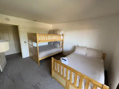 a small bedroom with a bunk bed and a staircase at Mountain Villa in San Diego - Pool & Waterslide, Spa, Pickle Ball, Game room in La Mesa