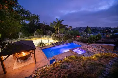 an overhead view of a swimming pool with a table and a table at Mountain Villa in San Diego - Pool & Waterslide, Spa, Pickle Ball, Game room in La Mesa