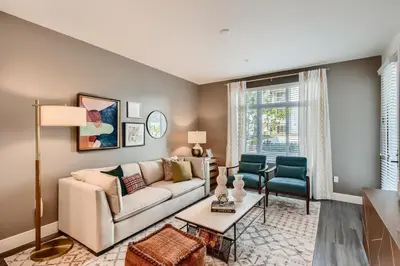 a living room with a couch and a table at Vive Luxe in San Diego