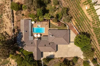 an overhead view of a house with a swimming pool at Casa Verde Wine Country Estate w Pickleball Casita in Temecula