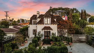 a house with an american flag on top of it at European Charm Meets La Jolla Rooftop Views in San Diego