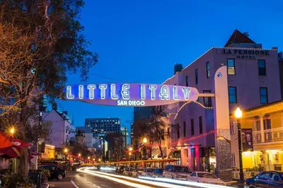 a neon sign that reads little italy on a city street at Sunny Retreat Beaches Lakes Trails in La Mesa