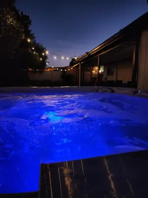 a swimming pool with blue lighting at night at Sunny Retreat Beaches Lakes Trails in La Mesa