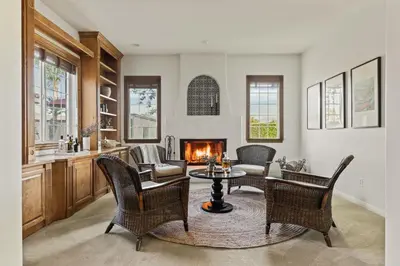 a living room with a table and chairs and a fireplace at Villa Verdot 6BR Estate w Pool Tennis Basketball in Temecula