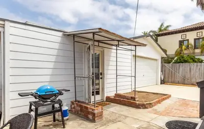a barbecue grill in front of a house at Studio In Carlsbad Village in Carlsbad