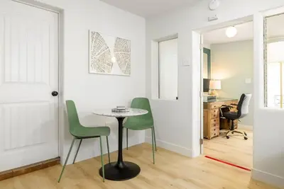 a room with a table and two chairs and a desk at Studio In Carlsbad Village in Carlsbad