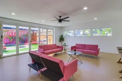 a living room with red chairs and a ceiling fan at Events Allowed: Sunny Villa| Lake| Trails| Beach in La Mesa