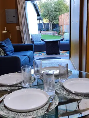 a table with plates and glasses on top of it at Events Allowed: Sunny Villa| Lake| Trails| Beach in La Mesa