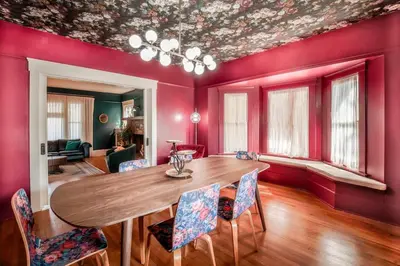 a dining room with a wooden table and chairs at Gorgeous Eccentric Family Home with Cowboy Pool in San Diego