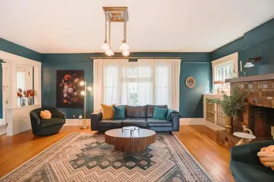 a living room with a couch and a table at Gorgeous Eccentric Family Home with Cowboy Pool in San Diego