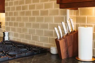 a kitchen counter with a knife block and a stove at Gorgeous Eccentric Family Home with Cowboy Pool in San Diego
