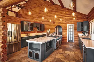 a large kitchen with wooden walls and a wooden ceiling at Red Hawk Ridge SD Mag Design Winner in Alpine