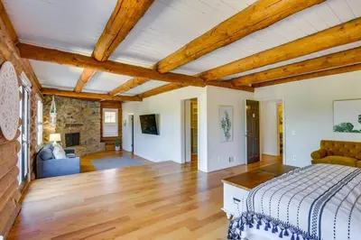 a bedroom with a bed and a living room at Red Hawk Ridge SD Mag Design Winner in Alpine