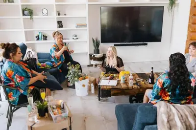 a group of women sitting in a living room at Japatul House w Pool & Spa 5 Star Google Reviews in Alpine