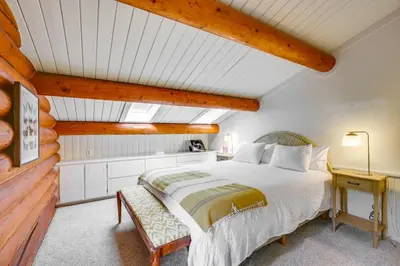a bedroom with a large bed in a attic at Japatul House w Pool & Spa 5 Star Google Reviews in Alpine