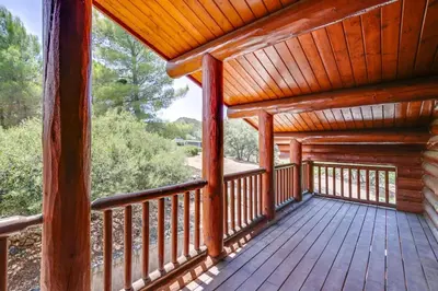 a porch of a log cabin with a wooden deck at Japatul House w Pool & Spa 5 Star Google Reviews in Alpine