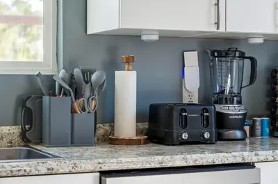 a kitchen counter with a blender and utensils at Westinghouse Park Retreat Decks, BBQ, Fire Pits in San Diego