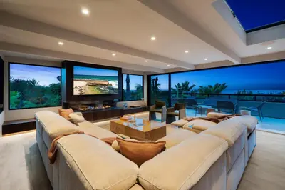 a large living room with a large couch and large windows at Solana Beach Luxury with Panoramic Ocean Views in Solana Beach