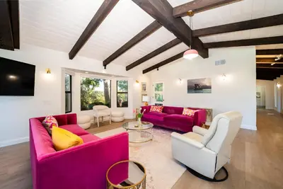a living room with two purple couches and chairs at Fallbrook Hilltop Sanctuary - Pool & Pickleball in Fallbrook