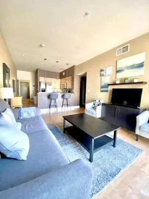 a living room with a couch and a coffee table at Allura Gaslamp Condo - Office Pool Gym & Parking in San Diego