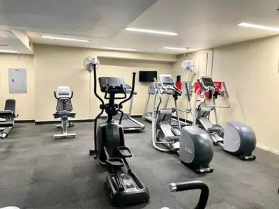 a gym with several exercise bikes in a room at Allura Gaslamp Condo - Office Pool Gym & Parking in San Diego