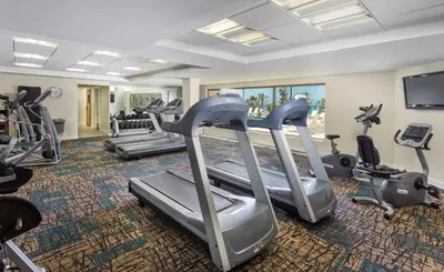 a fitness room with treadmills and cardio machines at Wyndham Oceanside Pier 2BR Apartment with Resort Access in Oceanside
