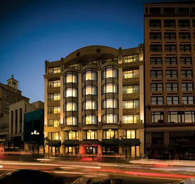 a building on a city street at night at Wyndham Harbour Lights Studio Apartment with Resort Access in San Diego