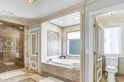 a bathroom with a tub and a toilet and a shower at Fountainhead Vineyards Manor in Temecula