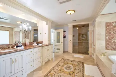 a bathroom with two sinks and a shower at Fountainhead Vineyards Manor in Temecula