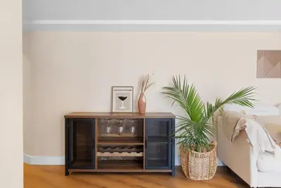 a side table in a living room next to a couch at Sunset house in El Cajon