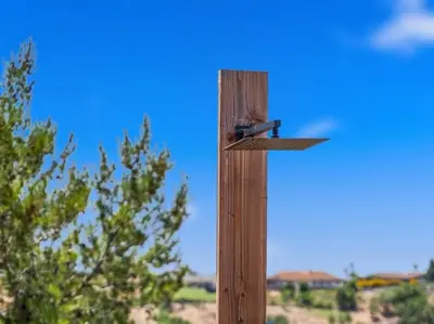 a wooden post with a bird feeder on it at Sunset house in El Cajon