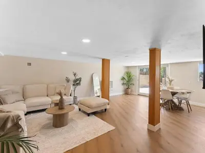 a living room with a couch and a table at Sunset house in El Cajon