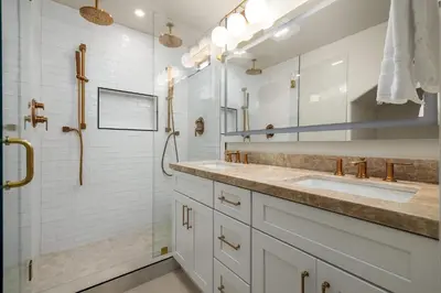 a bathroom with two sinks and a shower at The 357 Beach Pad, Renovated, Refined, Steps from the Surf! in San Diego