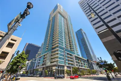 a tall building in the middle of a city at NEW Upscale Downtown San Diego Stay Queen Bed Pool & Sauna in San Diego