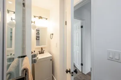 a bathroom with a sink and a mirror at Beautiful cozy home in San Diego in San Diego