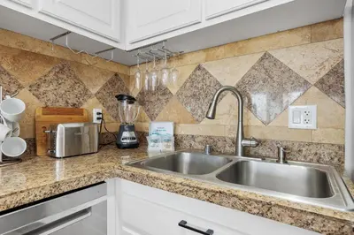 a kitchen counter with a sink and a blender at Sandy Wheels - DMST66 in Solana Beach
