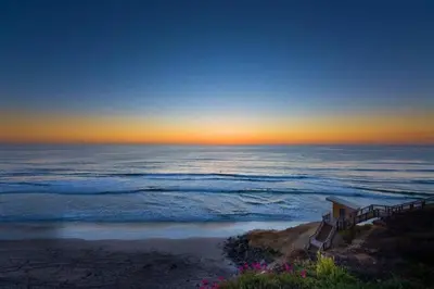 a view of the ocean from a beach at sunset at Sandy Wheels - DMST66 in Solana Beach