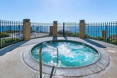 a hot tub in front of a fence at Sandy Wheels - DMST66 in Solana Beach