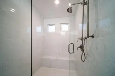 a bathroom with a shower with a glass door at La Jolla Panoramic Ocean Retreat with Rooftop in San Diego
