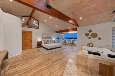a large living room with a bathtub and a couch at Pacific Beach Oceanfront Compound with Casita in San Diego