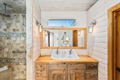 a bathroom with a sink and a mirror at Pacific Beach Oceanfront Compound with Casita in San Diego