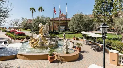 a fountain in the middle of a courtyard at Marriott's Newport Coast 2BR Apartment with Resort Access in Newport Beach