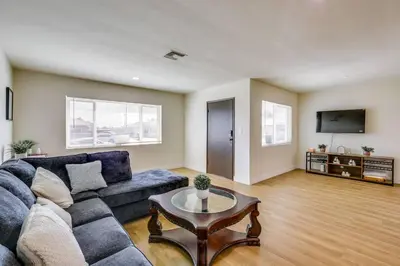 a living room with a couch and a table at Nice and Comfortable for family in San Diego