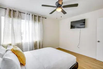 a bedroom with a bed and a ceiling fan at Nice and Comfortable for family in San Diego