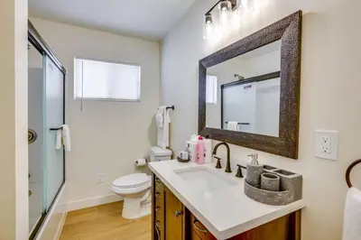 a bathroom with a sink and a toilet and a mirror at Nice and Comfortable for family in San Diego