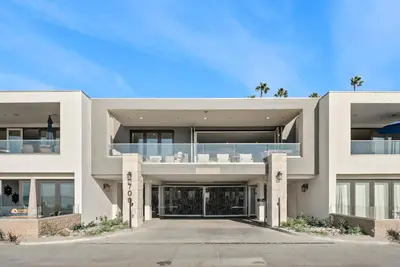 a large white house with a driveway at The Penthouse Oceanfront in Oceanside
